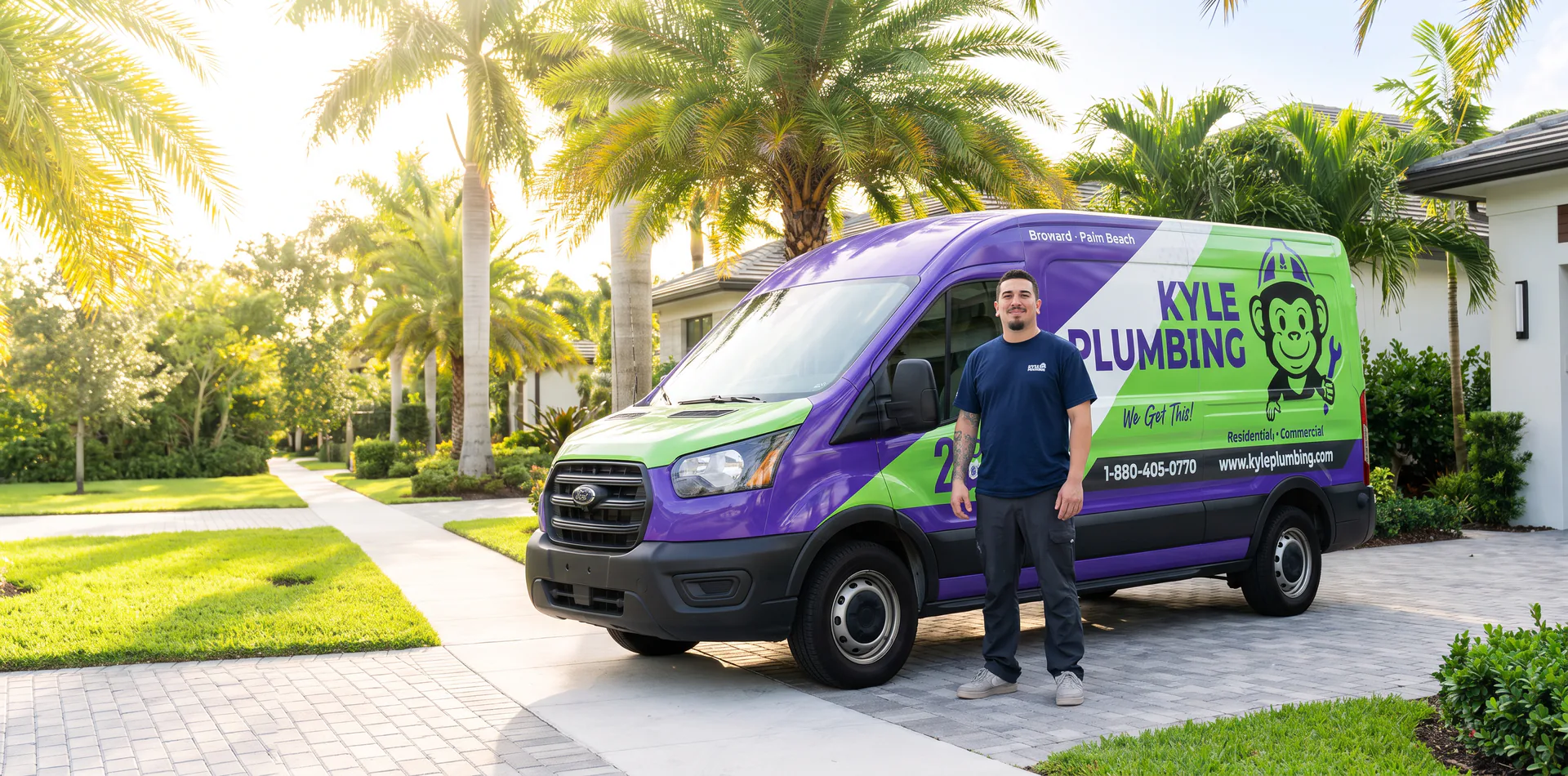 A Kyle Plumbing technician standing proudly beside a branded service van in a South Florida neighborhood